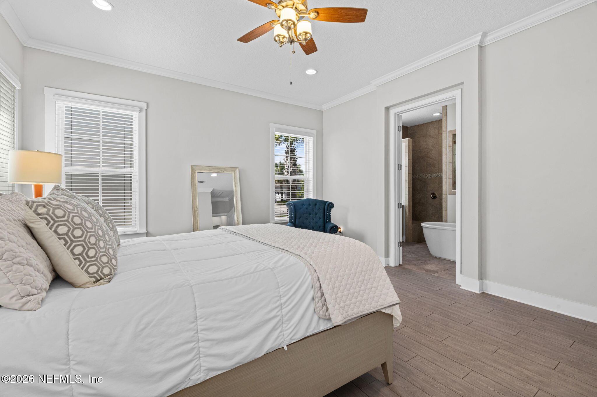 44 Fremont Avenue St. Augustine, FL 32095 - Photo 19 of 72 a bedroom with a bed and a chandelier