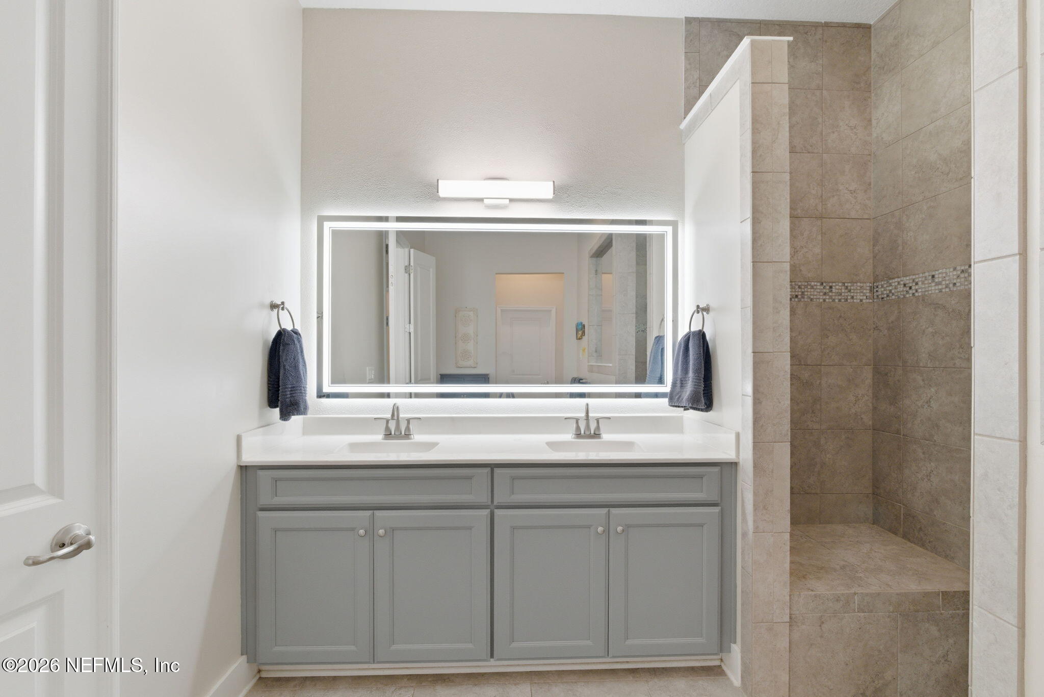 44 Fremont Avenue St. Augustine, FL 32095 - Photo 20 of 72 a bathroom with a sink vanity and mirror
