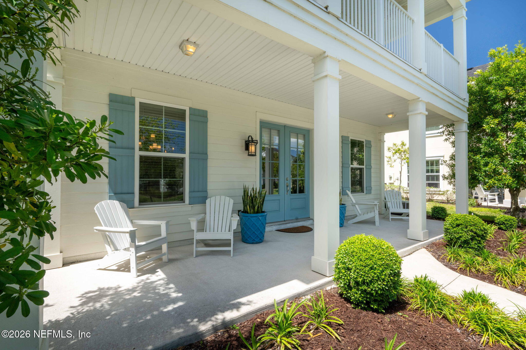 44 Fremont Avenue St. Augustine, FL 32095 - Photo 48 of 72 a view of a patio with table and chairs potted plants and floor to ceiling window and potted plants