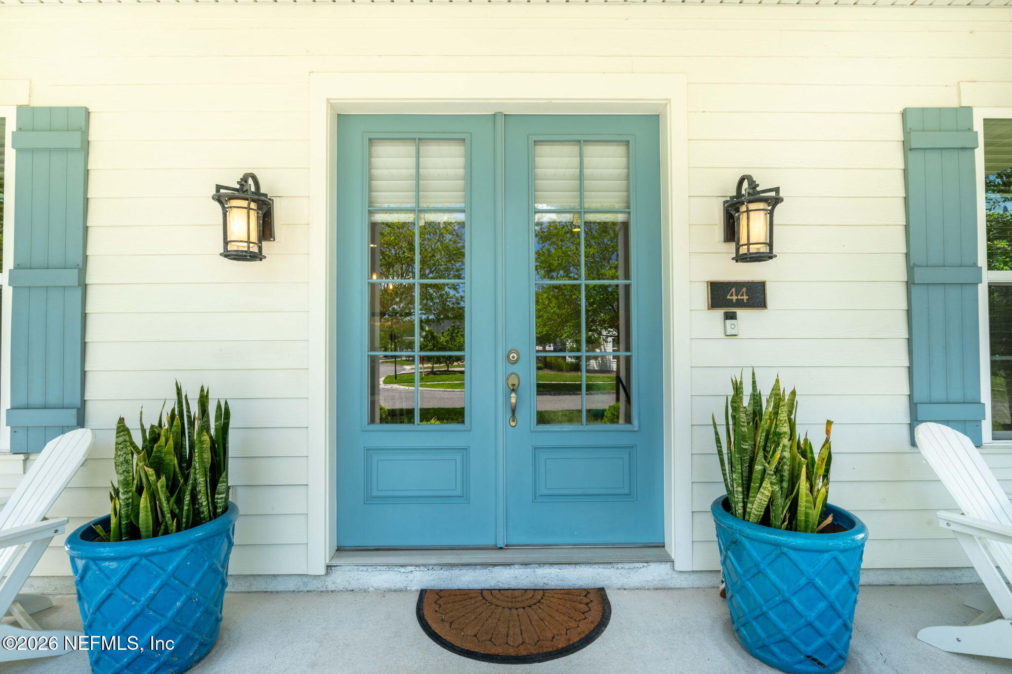 44 Fremont Avenue St. Augustine, FL 32095 - Photo 50 of 72 a view of a potted plant in front of a door