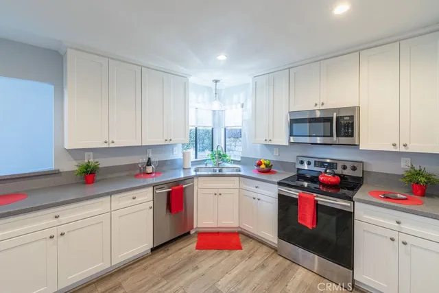 a kitchen with sink cabinets and window