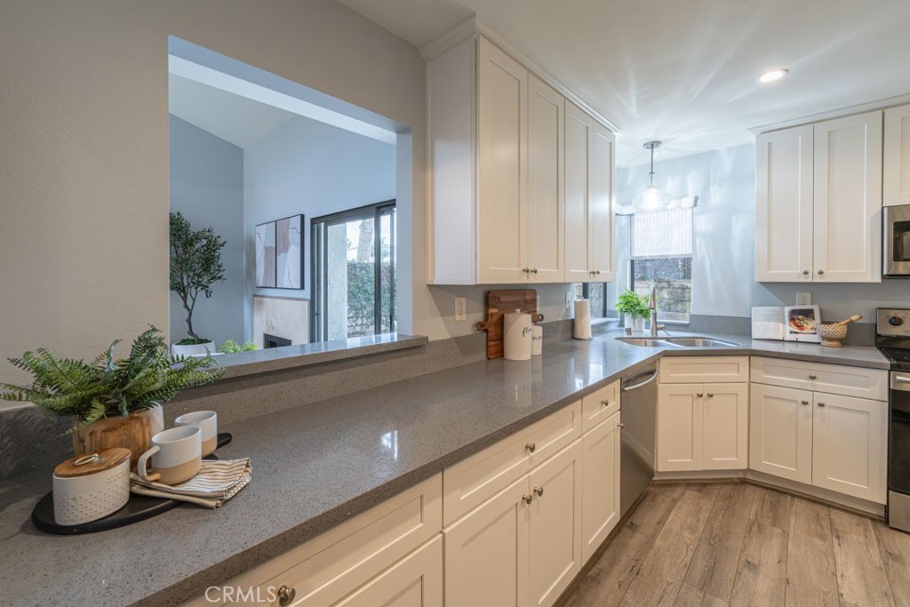5002 East Atherton Street Long Beach, CA 90815 - Photo 12 of 52 a kitchen with sink and window