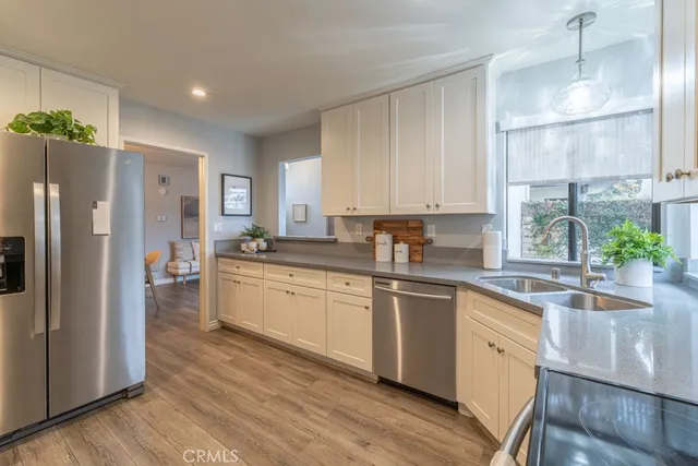 a kitchen with a sink stove and refrigerator