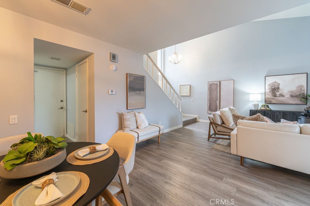 5002 East Atherton Street Long Beach, CA 90815 - Photo 19 of 52 a living room with furniture and wooden floor
