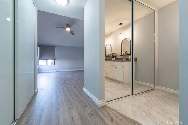 a view of a room with wooden floor
