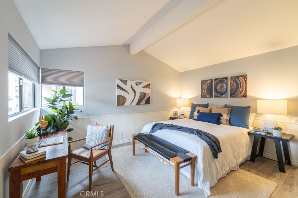5002 East Atherton Street Long Beach, CA 90815 - Photo 23 of 52 a bedroom with a bed and a potted plant