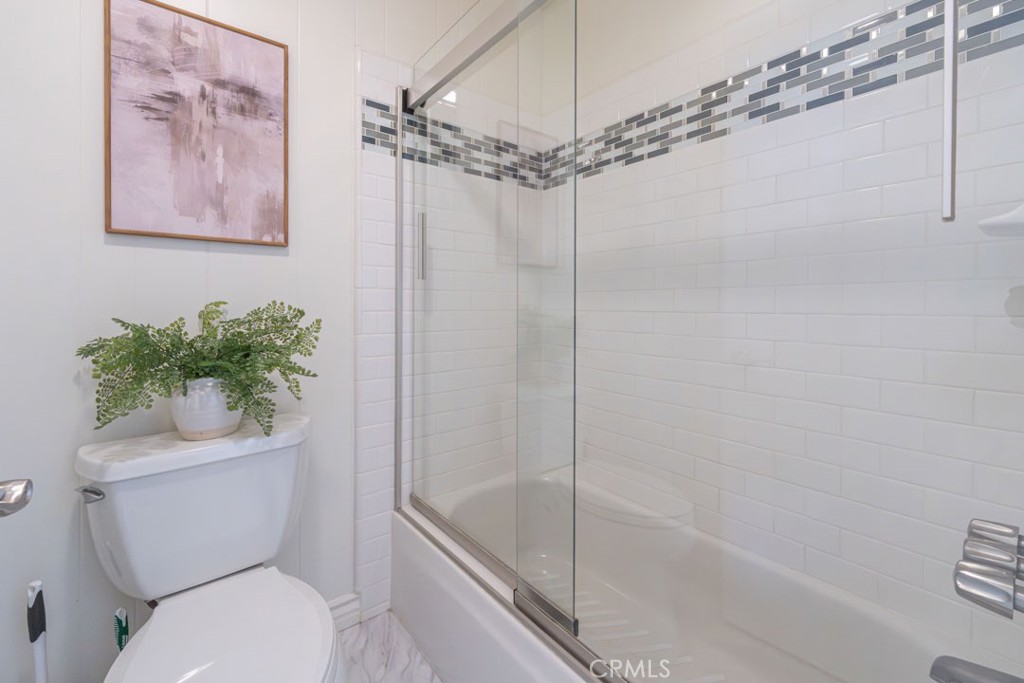 5002 East Atherton Street Long Beach, CA 90815 - Photo 27 of 52 a bath room with a toilet and a bath tub