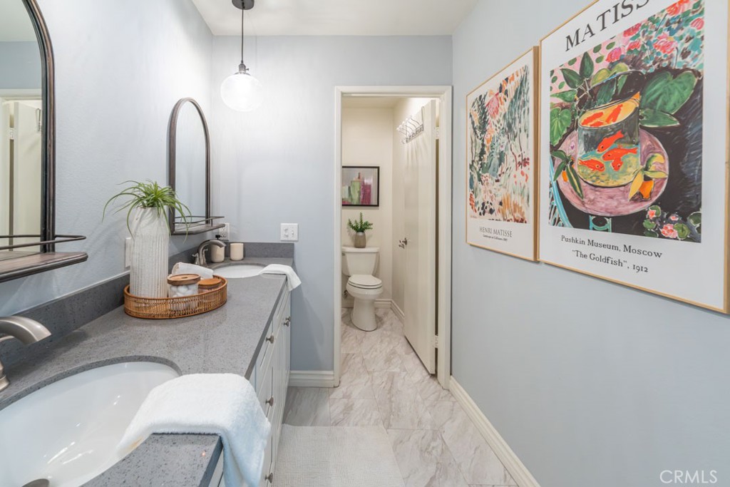 5002 East Atherton Street Long Beach, CA 90815 - Photo 35 of 52 a room with furniture and painting on the wall