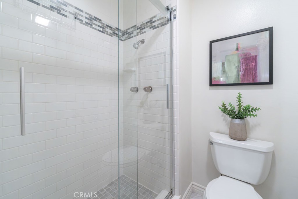 5002 East Atherton Street Long Beach, CA 90815 - Photo 36 of 52 a bathroom with a toilet and a shower