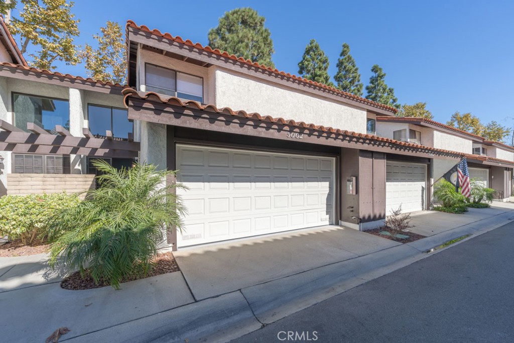 5002 East Atherton Street Long Beach, CA 90815 - Photo 45 of 52 a front view of a house with garden