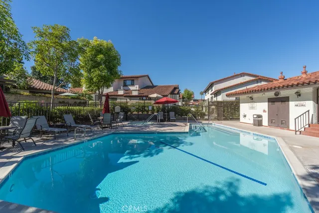 a view of a swimming pool with a yard