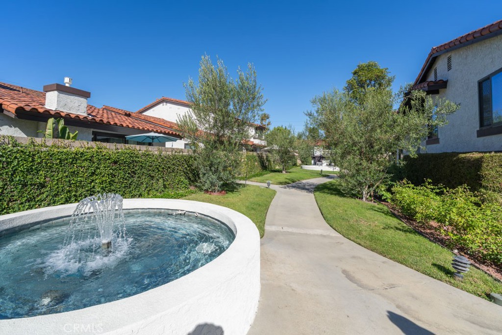 5002 East Atherton Street Long Beach, CA 90815 - Photo 49 of 52 a view of a swimming pool with a yard