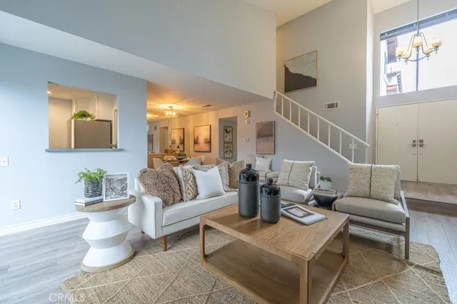 a living room with furniture or couch and a potted plant