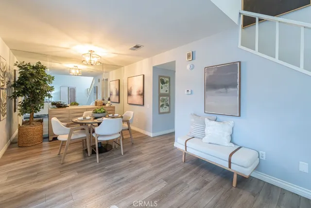 a living room with furniture a window and a table