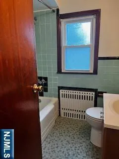 a bathroom with a bathtub and a toilet