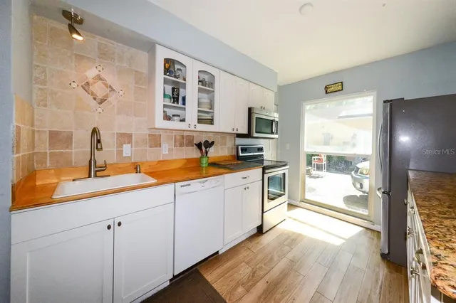 a view of a garden with swimming pool