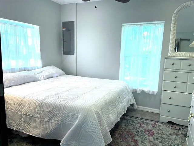 a view of a backyard with swimming pool