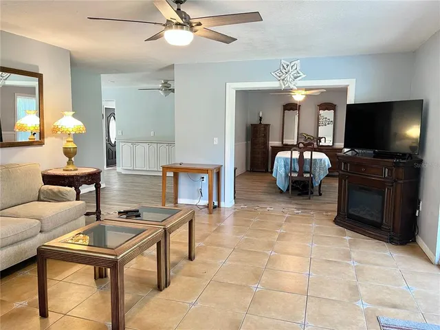 a front view of a house with a yard table and chairs