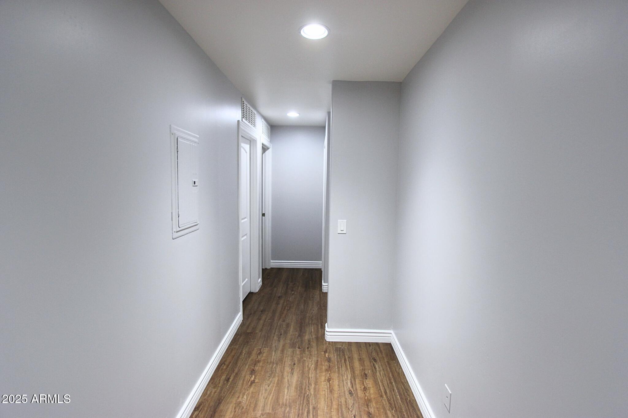 854 South San Marcos Drive, Unit A4 Apache Junction, AZ 85120 - Photo 14 of 22 a view of a hallway with wooden floor
