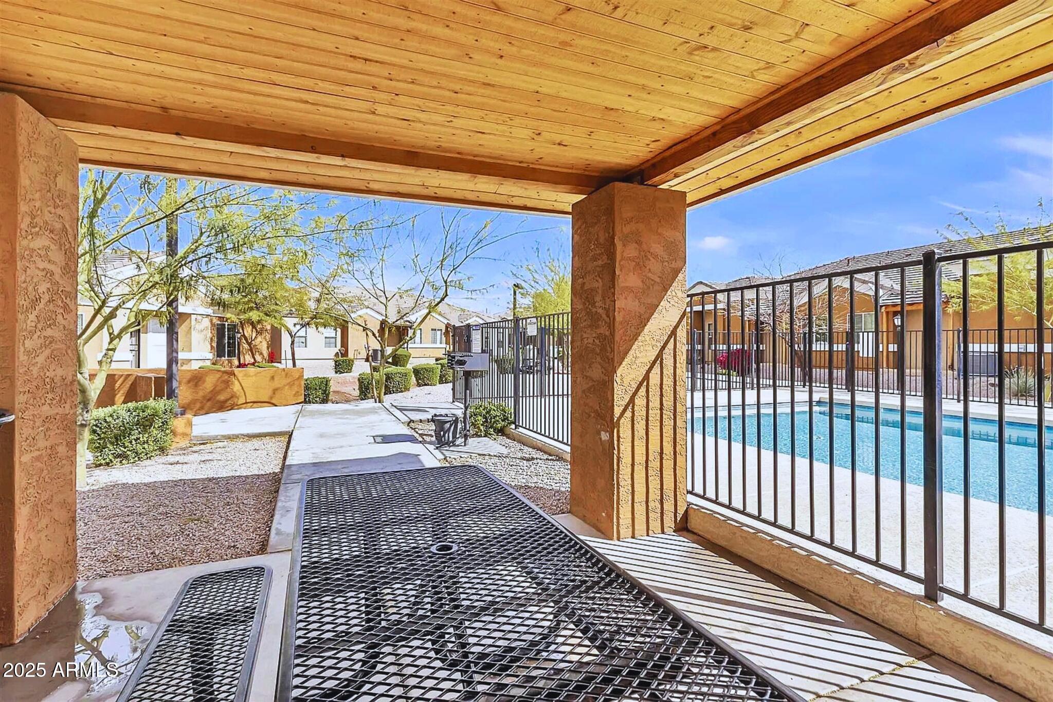 854 South San Marcos Drive, Unit A4 Apache Junction, AZ 85120 - Photo 21 of 22 a view of a porch with wooden floor