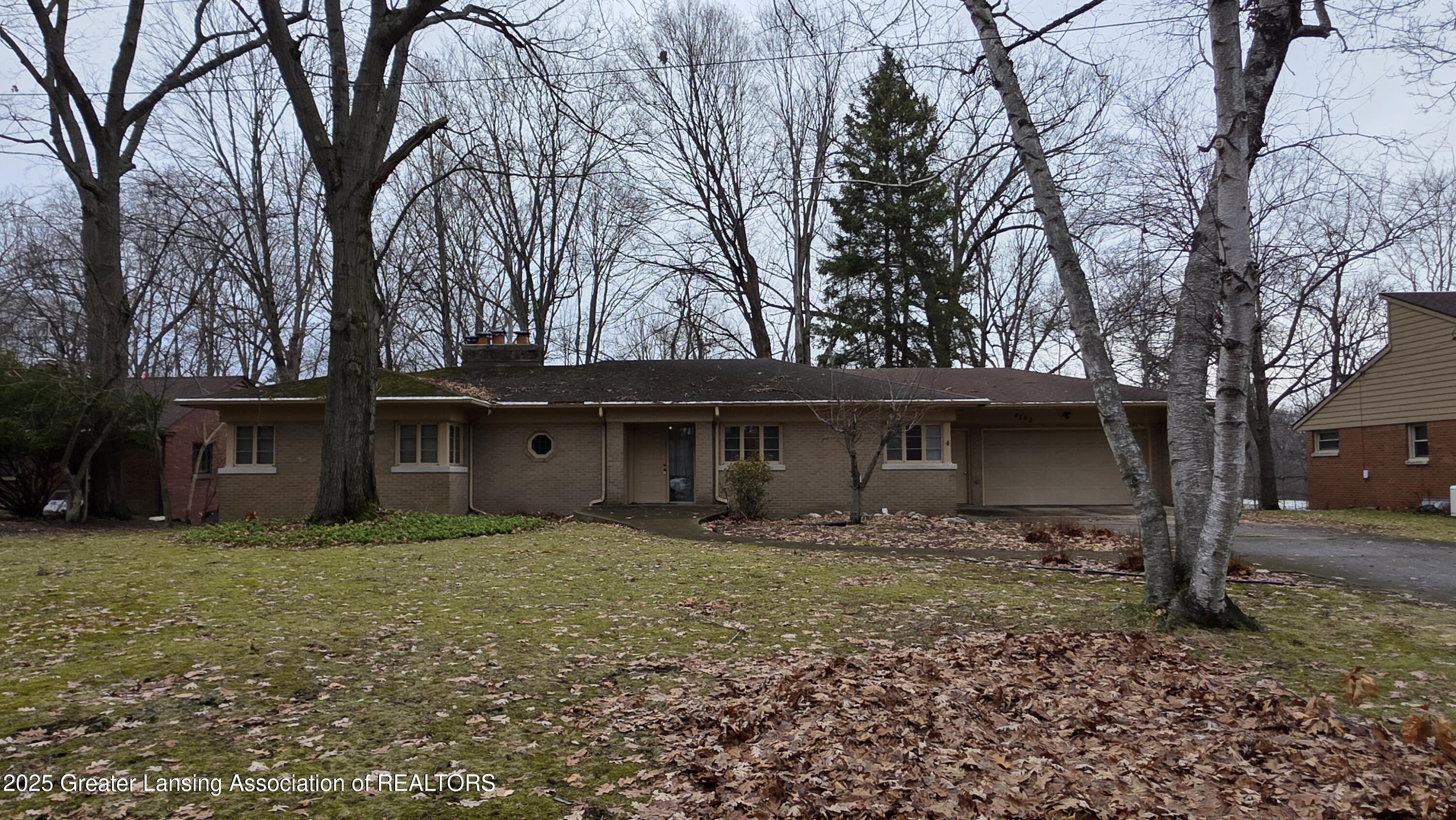 4702 Woodcraft Road Okemos, MI 48864 - Photo 2 of 57 20260108_154034