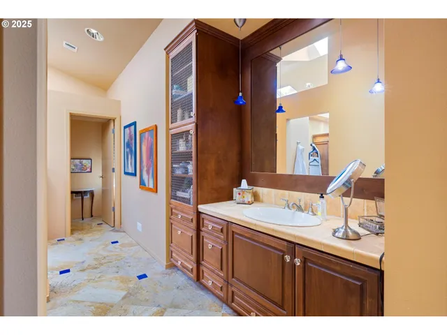 a bed room with a bed and a chair