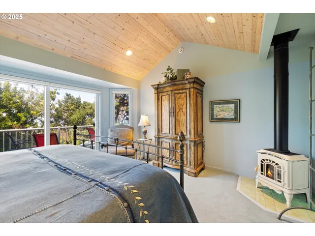 a bedroom with a large bed and a couch