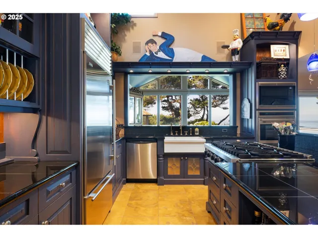 a kitchen with stainless steel appliances granite countertop a stove and cabinets