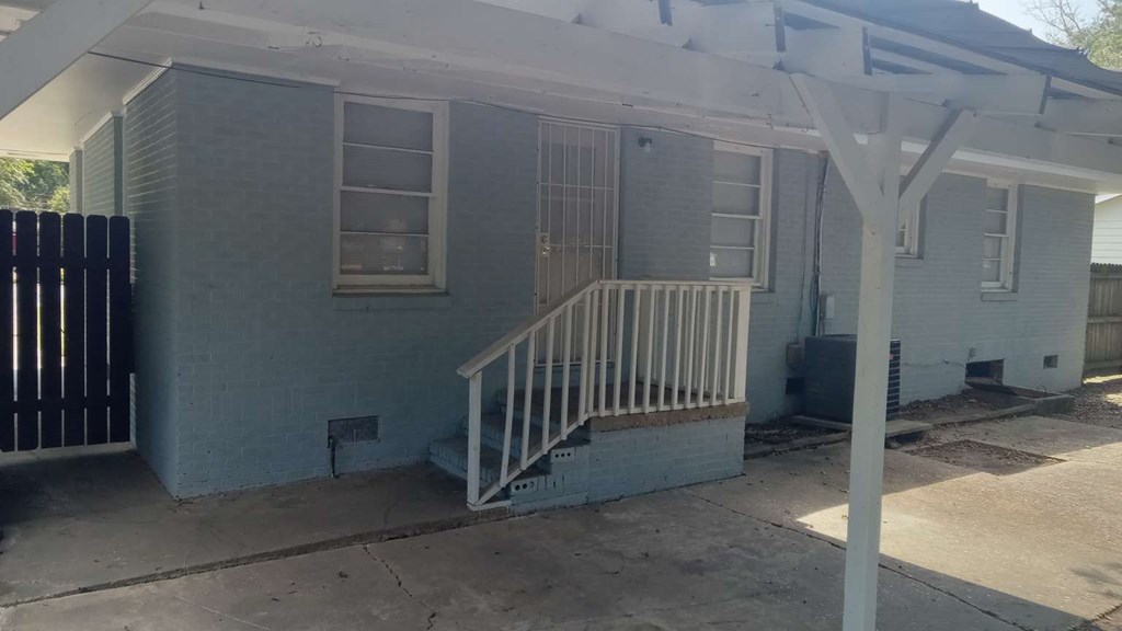 4229 Barr Street Columbus, GA 31907 - Photo 5 of 6 a view of a porch with a door and chair