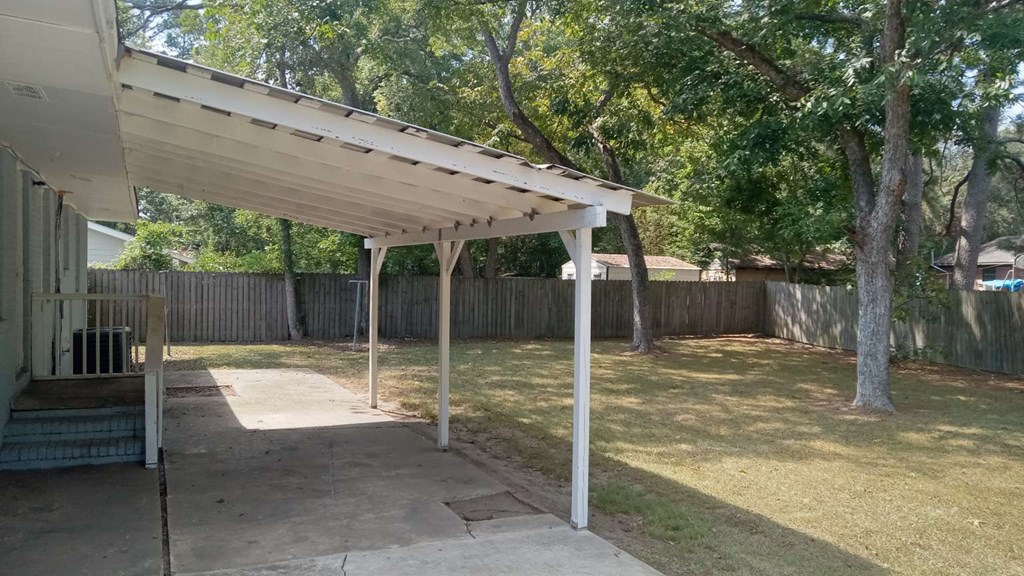4229 Barr Street Columbus, GA 31907 - Photo 6 of 6 a backyard of a house with a table and chairs