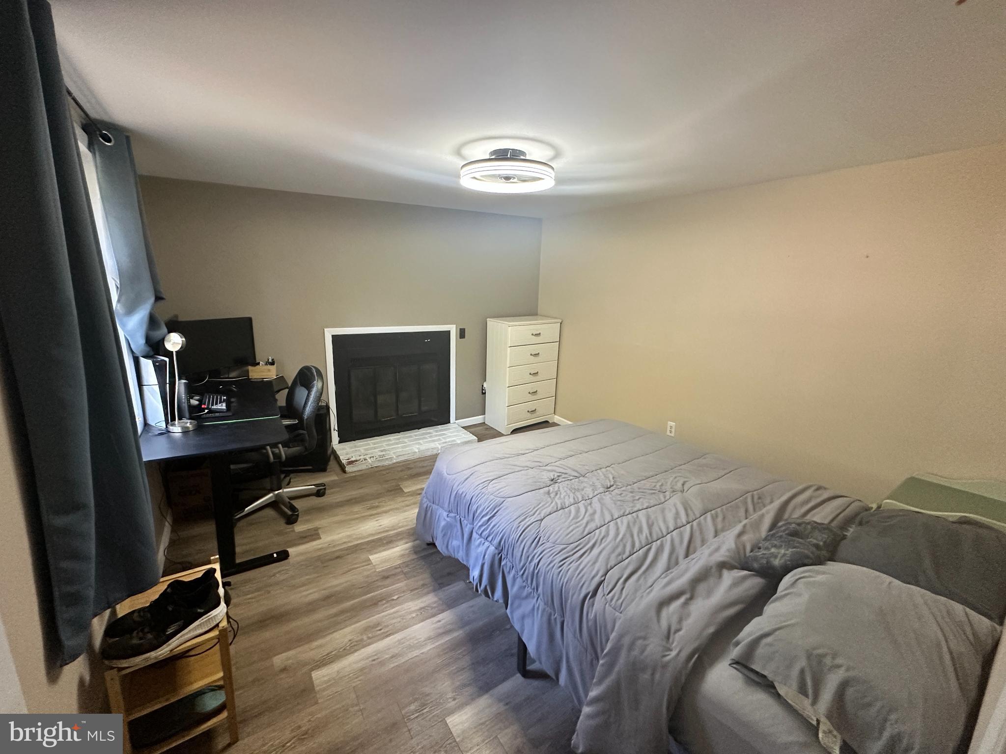 34481 Broad Water Road, Unit 643 Long Neck, DE 19966 - Photo 11 of 32 a bedroom with a bed and a desk