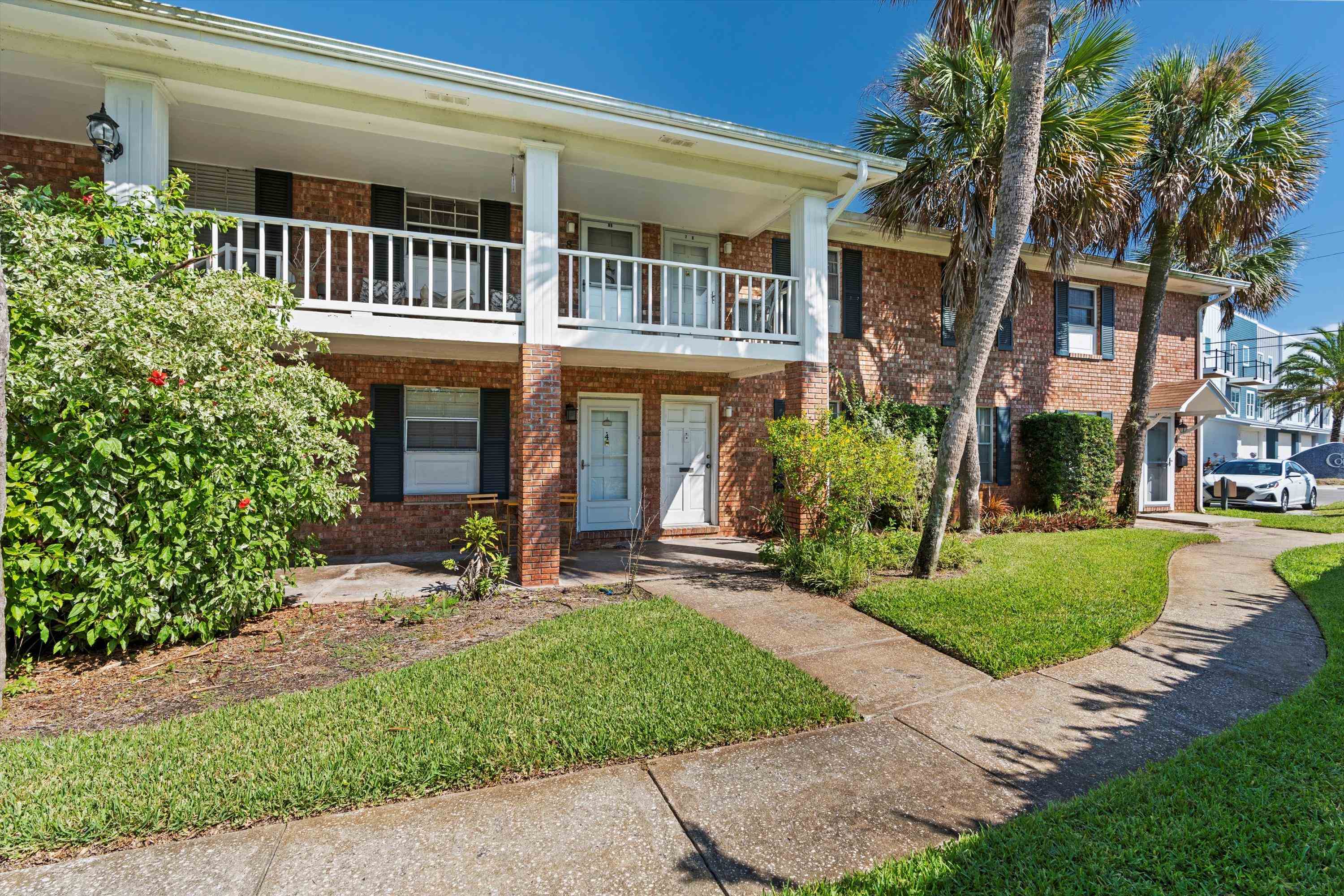 22 Comares Avenue, Unit 5B St. Augustine, FL 32080 - Photo 1 of 23 front view of a house with a yard