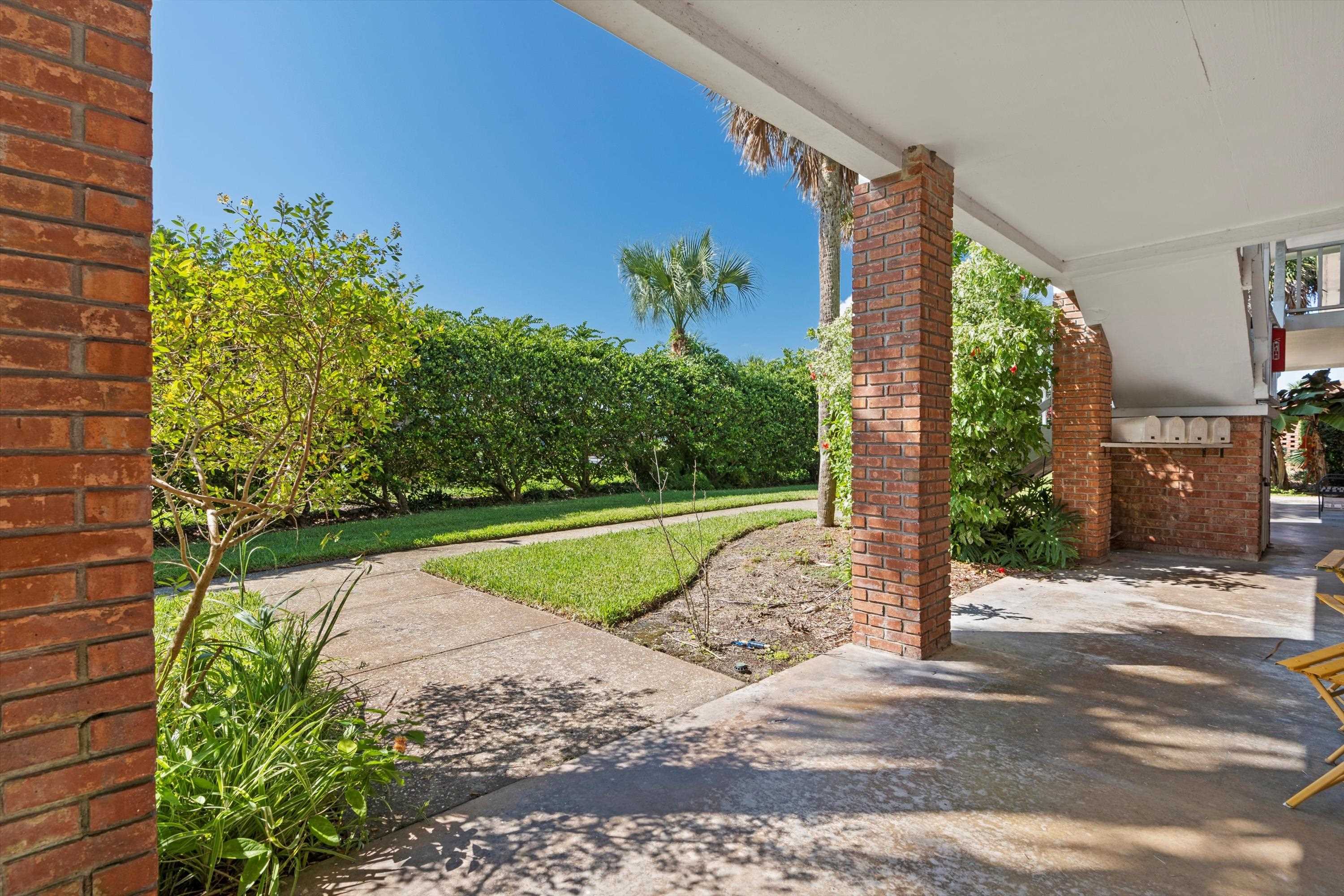 22 Comares Avenue, Unit 5B St. Augustine, FL 32080 - Photo 11 of 23 a view of a backyard with plants
