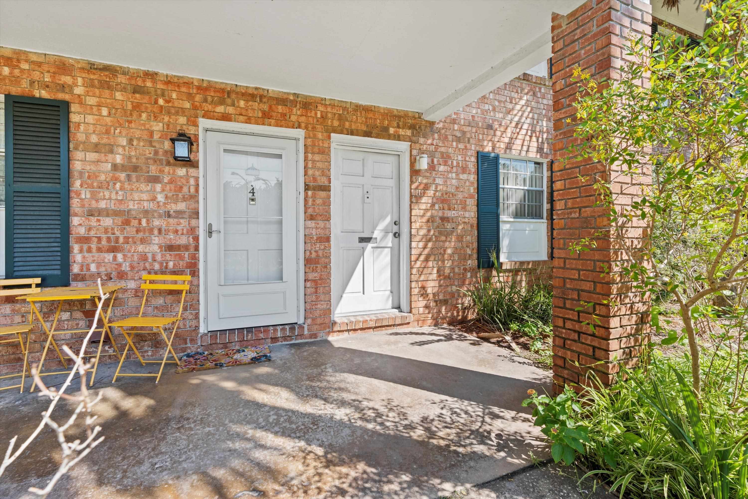 22 Comares Avenue, Unit 5B St. Augustine, FL 32080 - Photo 10 of 23 a front view of a house with chairs