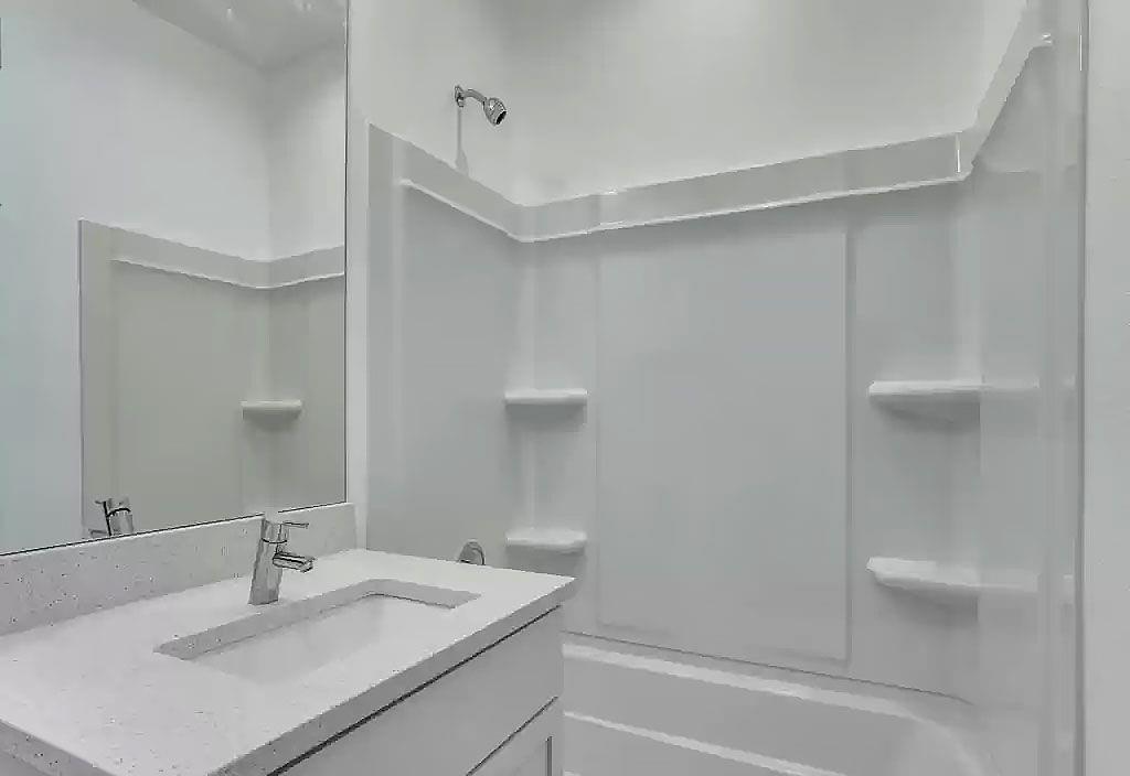 3275 Dallas Street, Unit 104 Dallas, TX 75210 - Photo 8 of 9 Bathroom featuring vanity and shower / tub combination