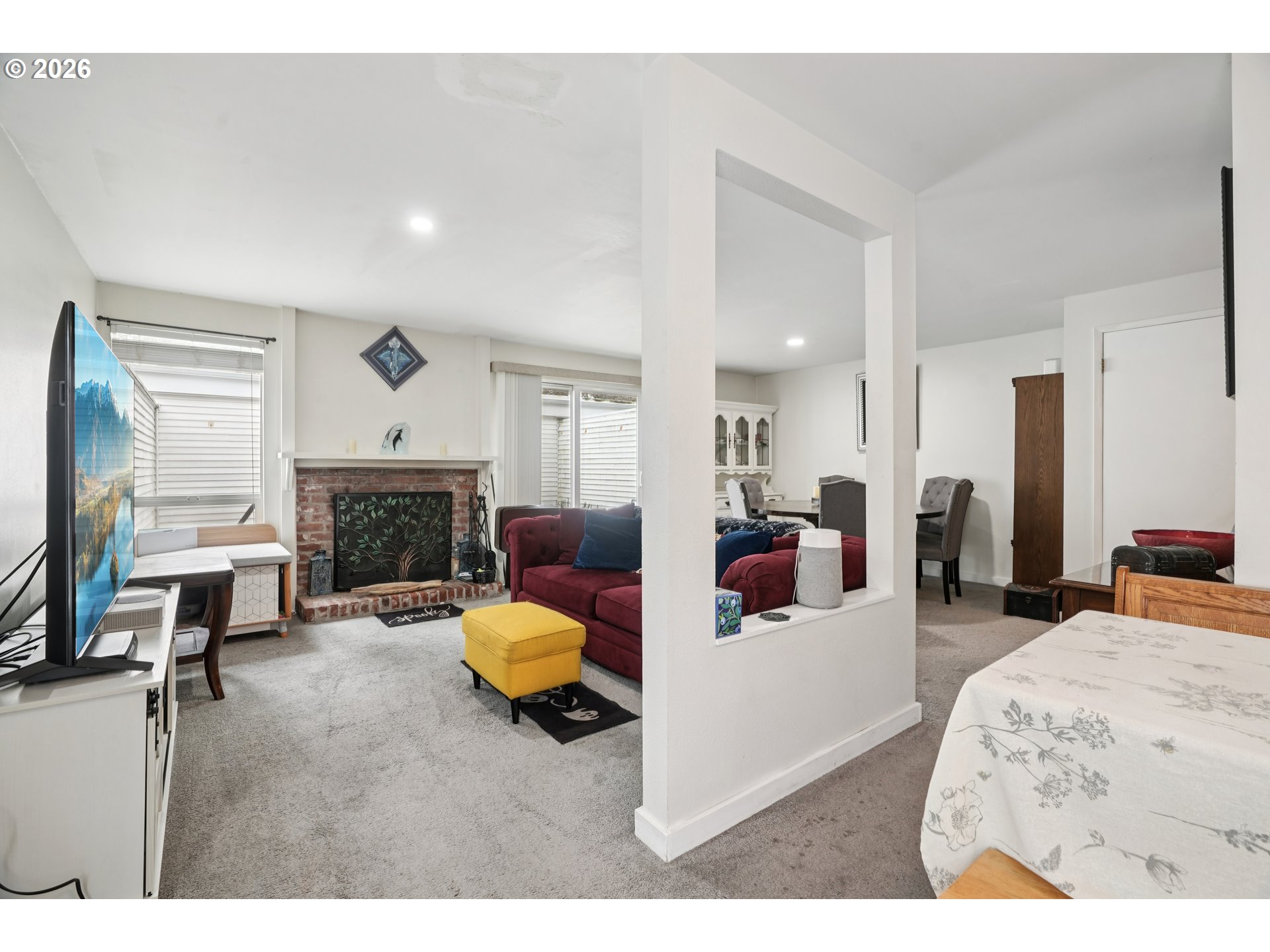 13050 Southwest 17th Street Beaverton, OR 97008 - Photo 14 of 35 a living room with furniture and a fireplace