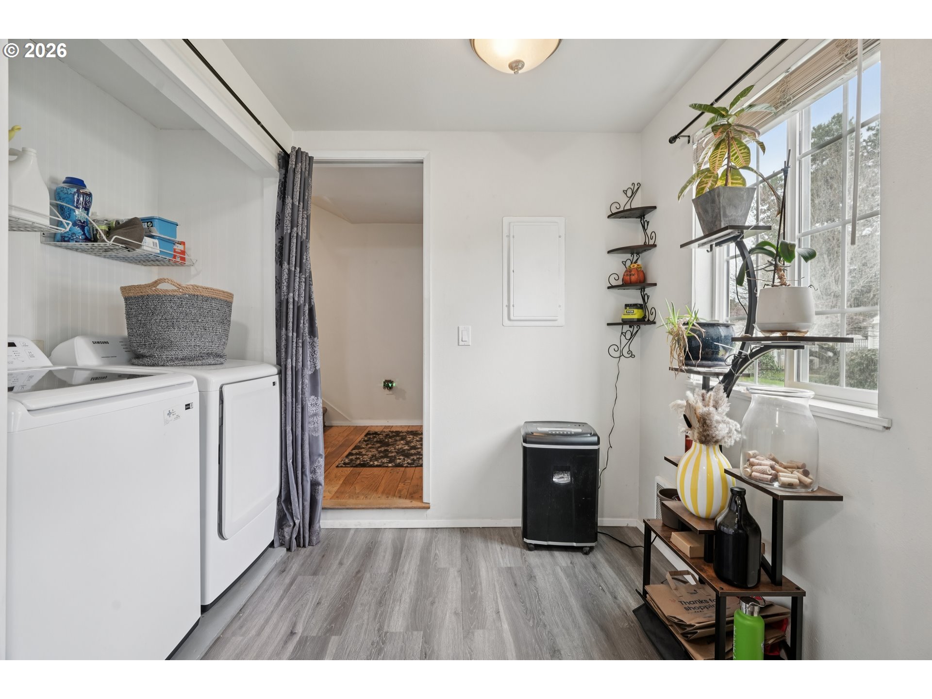 13050 Southwest 17th Street Beaverton, OR 97008 - Photo 19 of 35 a utility room with cabinets washer and dryer