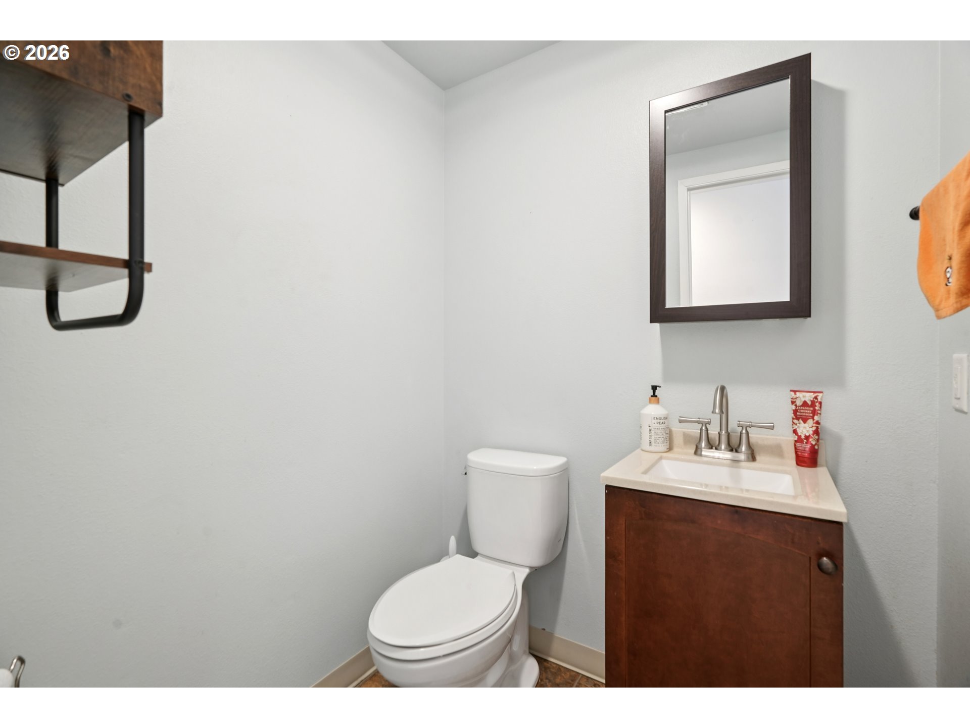 13050 Southwest 17th Street Beaverton, OR 97008 - Photo 21 of 35 a bathroom with a sink vanity mirror and toilet
