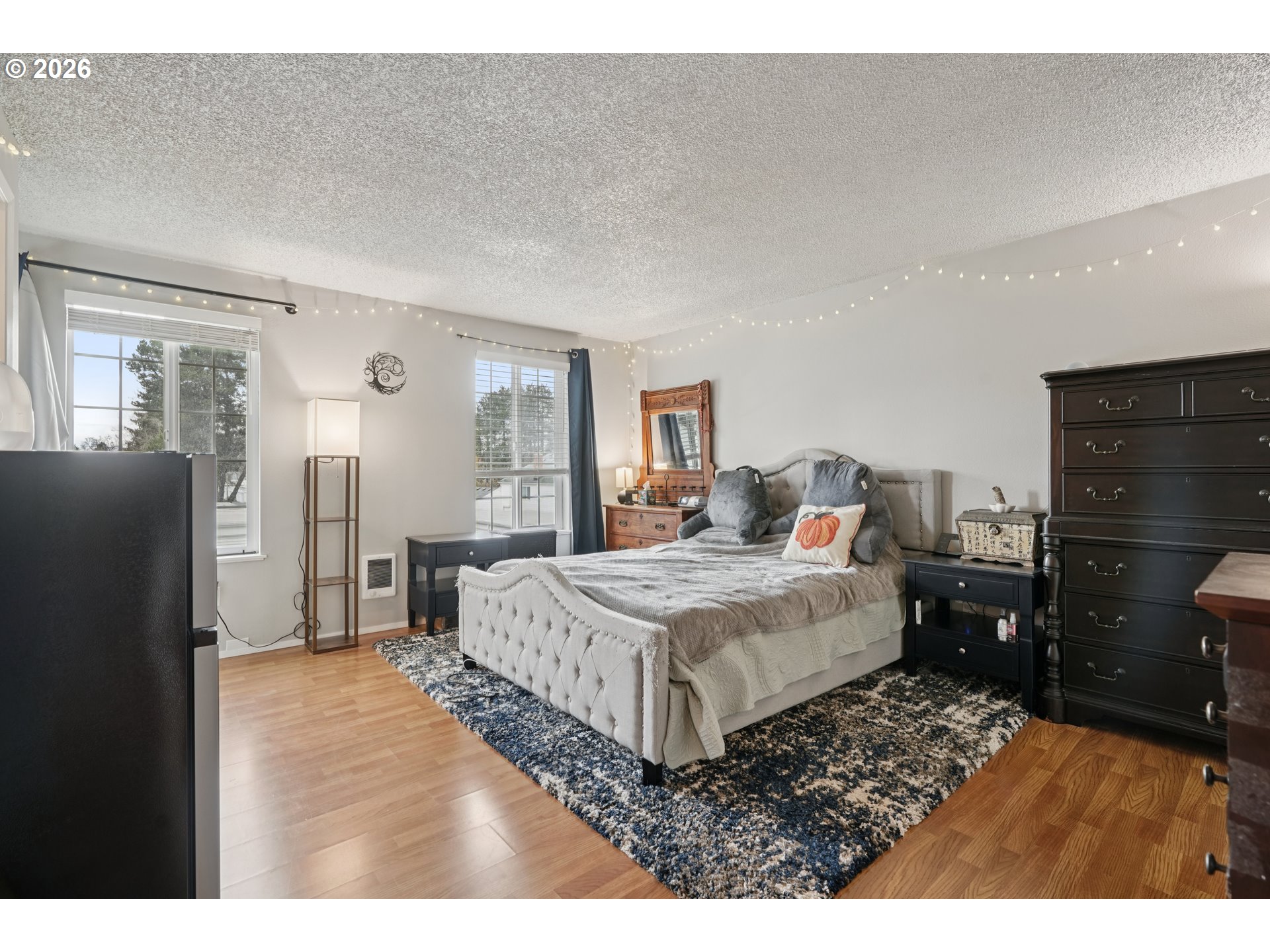 13050 Southwest 17th Street Beaverton, OR 97008 - Photo 22 of 35 a bedroom with a bed and wooden floor