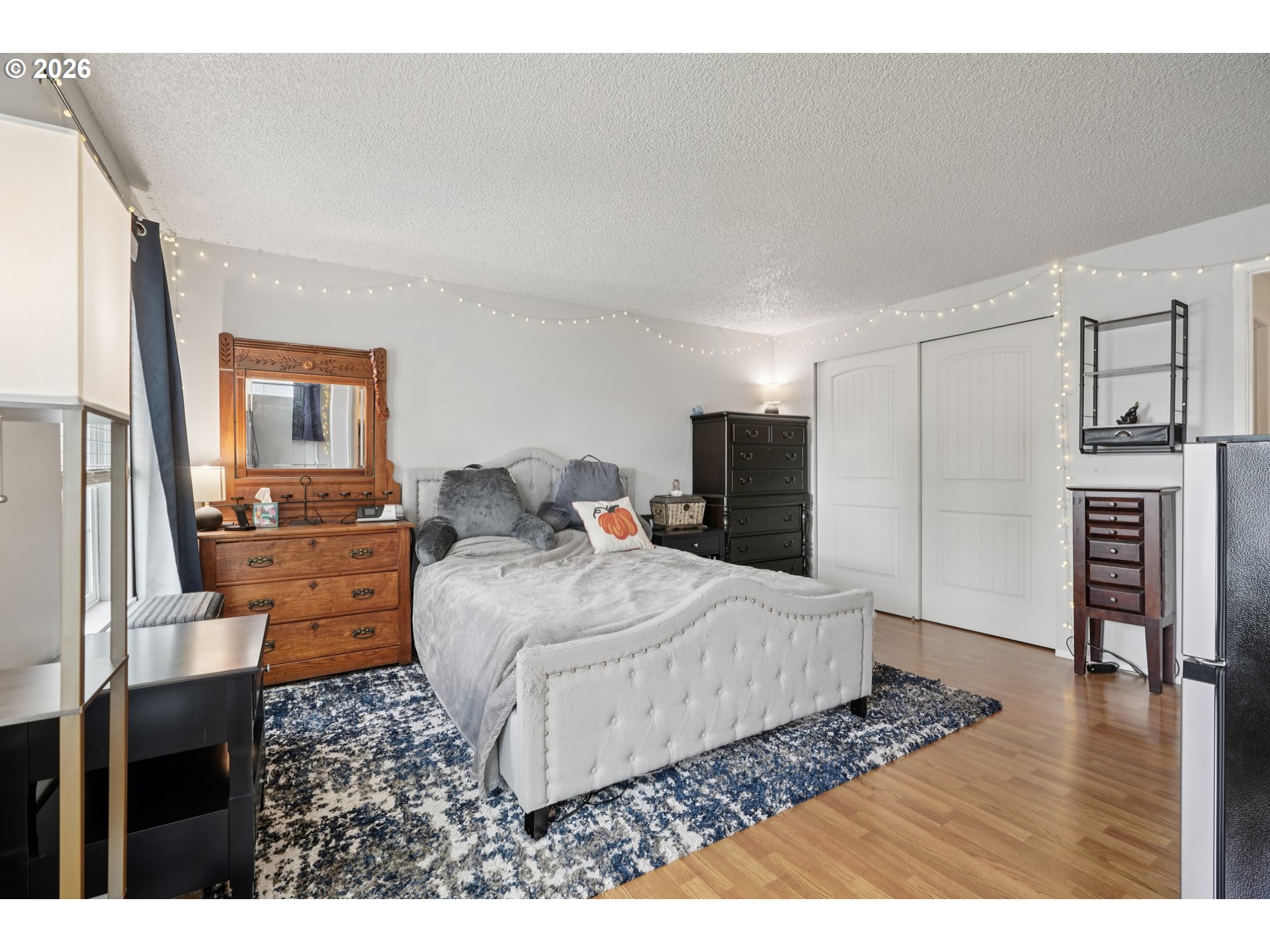 13050 Southwest 17th Street Beaverton, OR 97008 - Photo 23 of 35 a living room with furniture and a flat screen tv