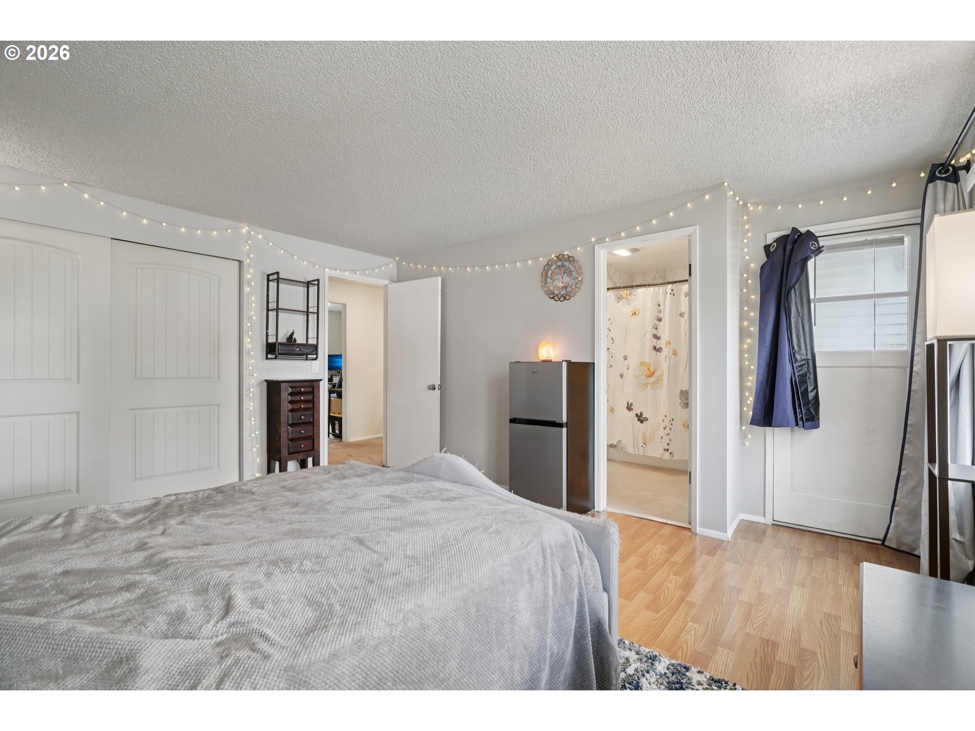 13050 Southwest 17th Street Beaverton, OR 97008 - Photo 24 of 35 a large white bed in a white room