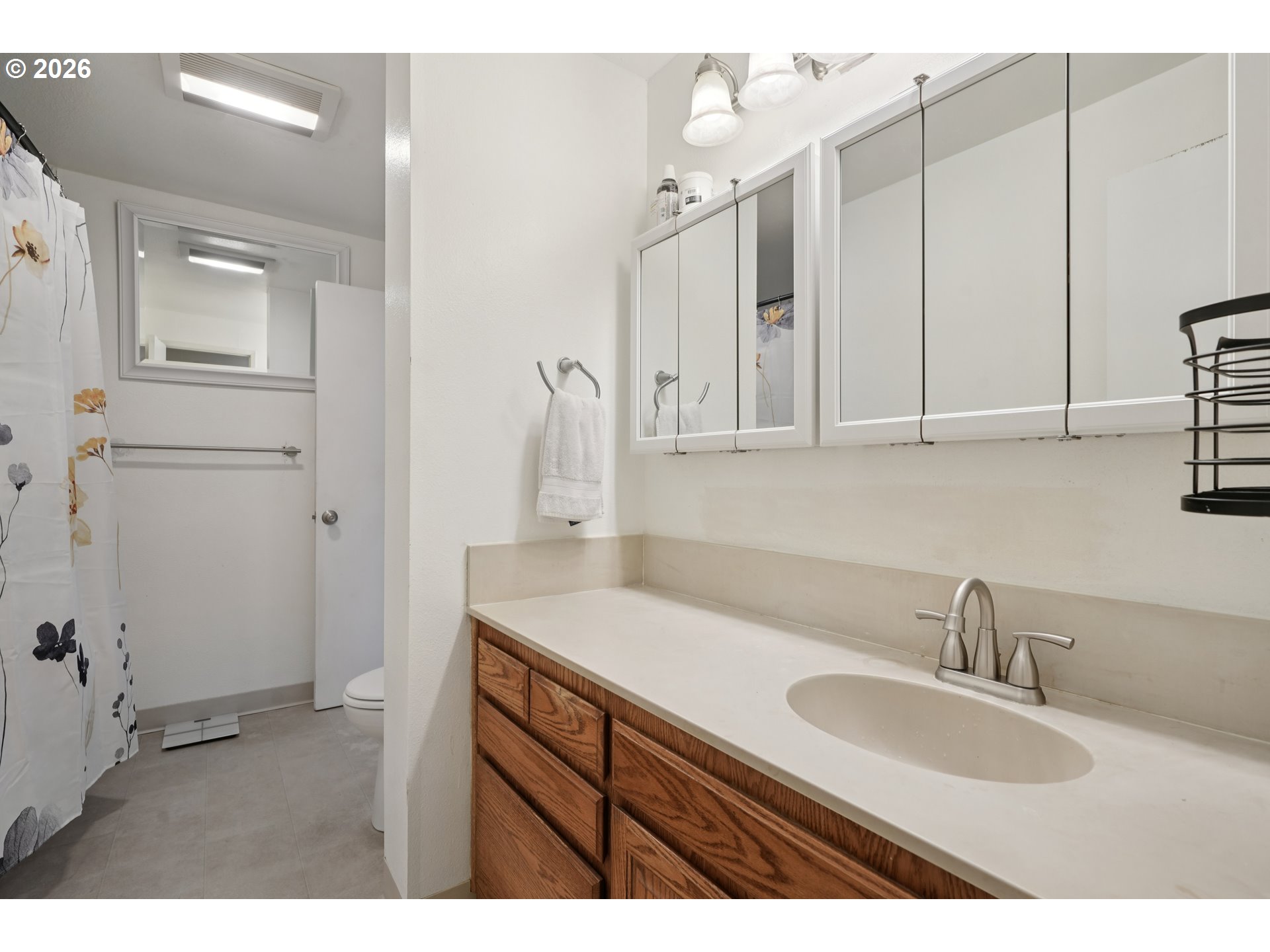 13050 Southwest 17th Street Beaverton, OR 97008 - Photo 25 of 35 a bathroom with a sink and a mirror