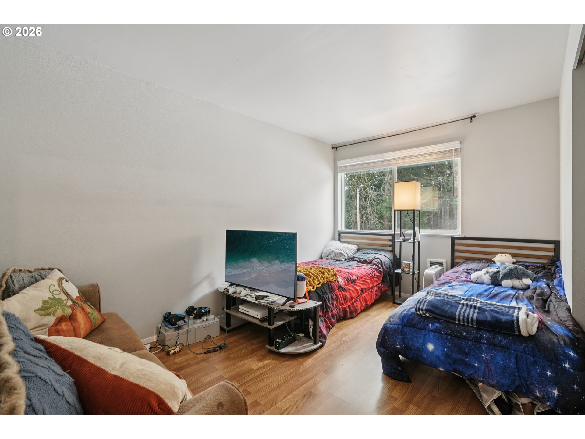13050 Southwest 17th Street Beaverton, OR 97008 - Photo 27 of 35 a bedroom with furniture and a flat screen tv