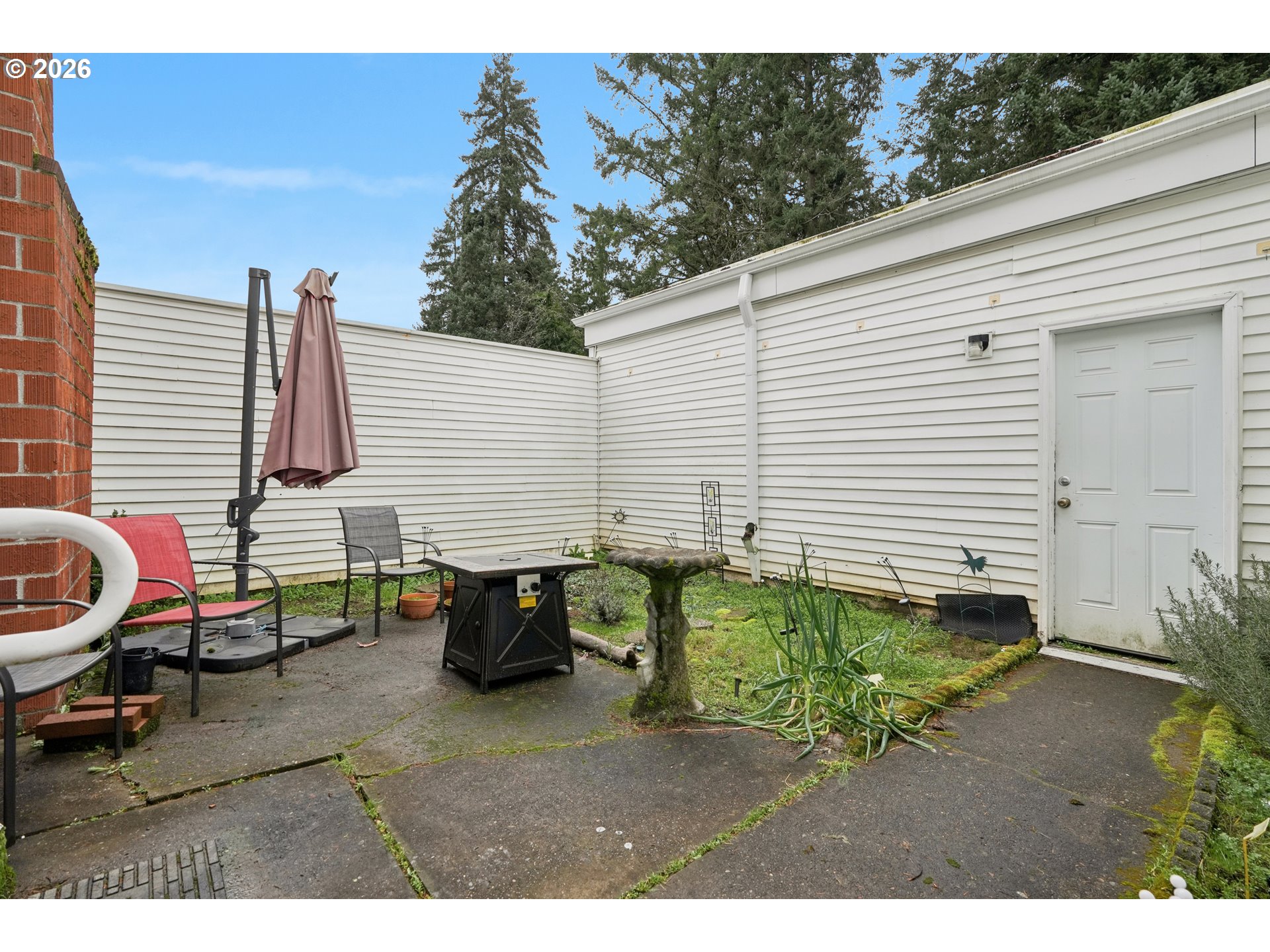 13050 Southwest 17th Street Beaverton, OR 97008 - Photo 29 of 35 a backyard of a house with wooden floor and outdoor seating