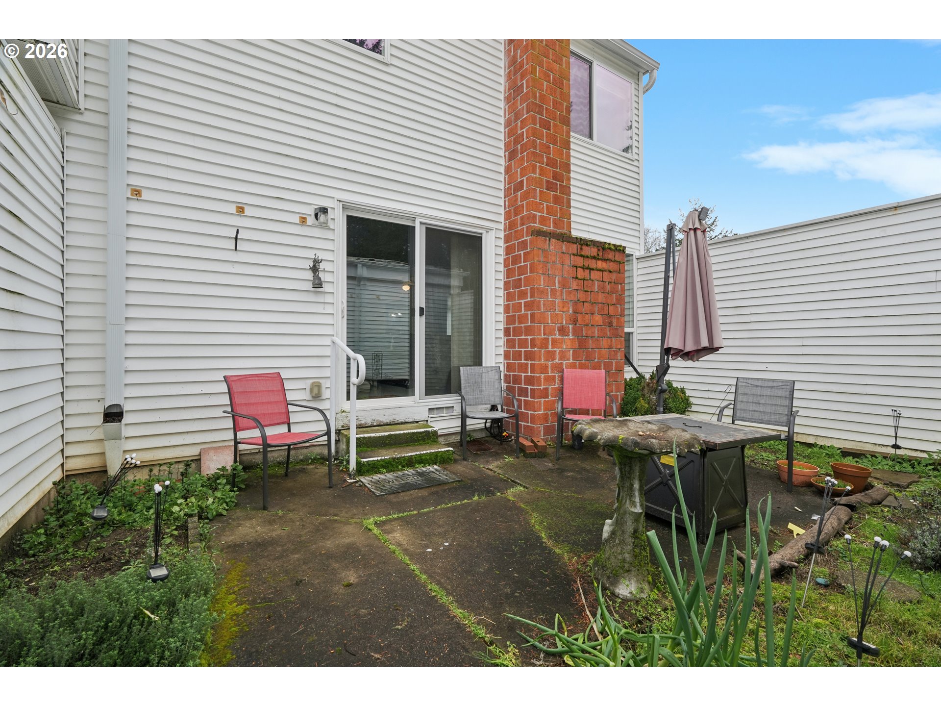 13050 Southwest 17th Street Beaverton, OR 97008 - Photo 30 of 35 a view of a chair and tables in the back yard