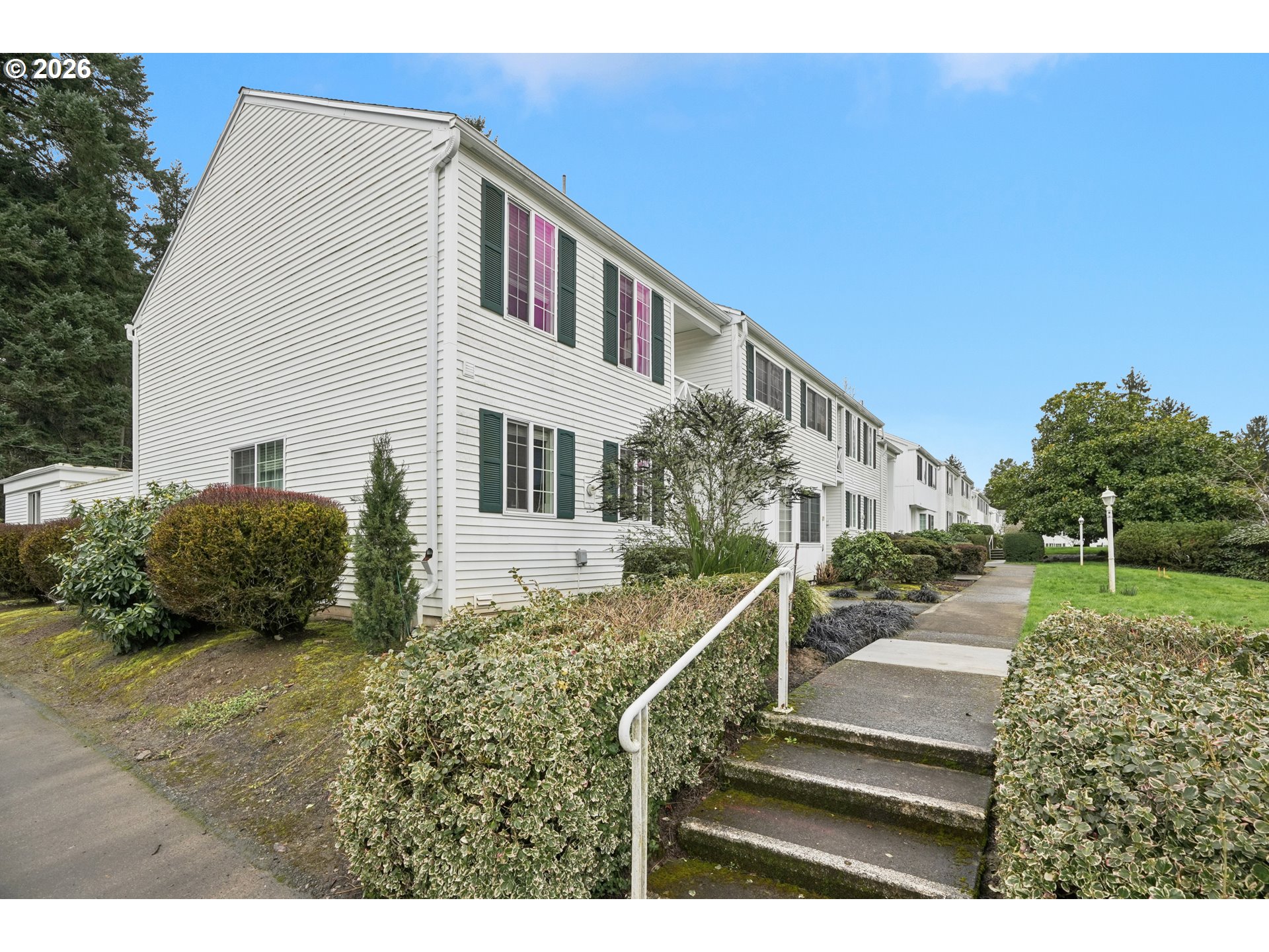 13050 Southwest 17th Street Beaverton, OR 97008 - Photo 3 of 35 a view of a house with backyard and trees