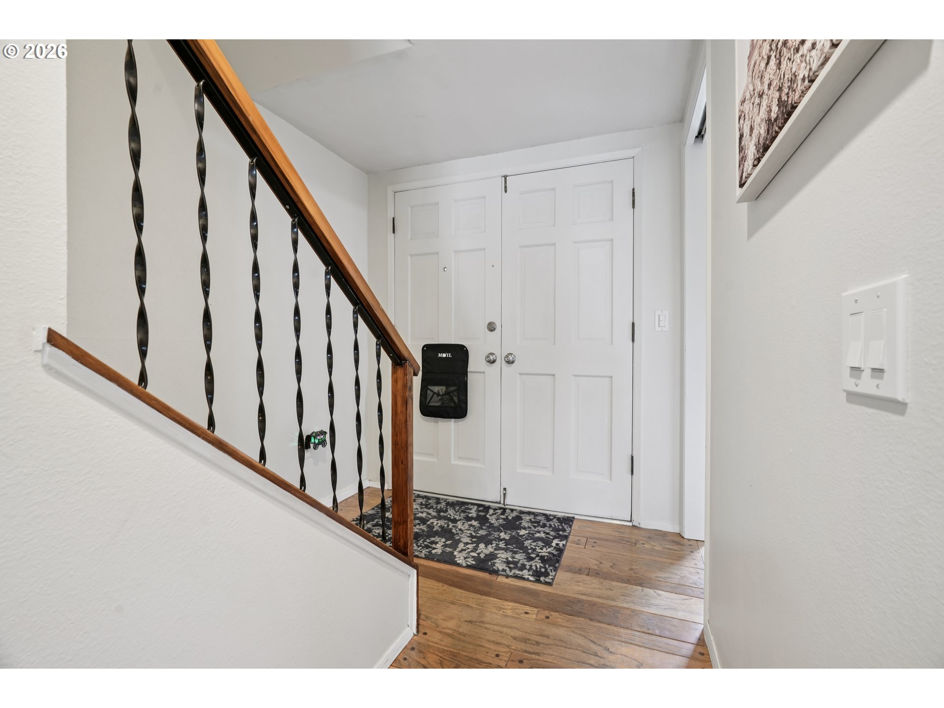 13050 Southwest 17th Street Beaverton, OR 97008 - Photo 6 of 35 a view of staircase with lots of frames on wall