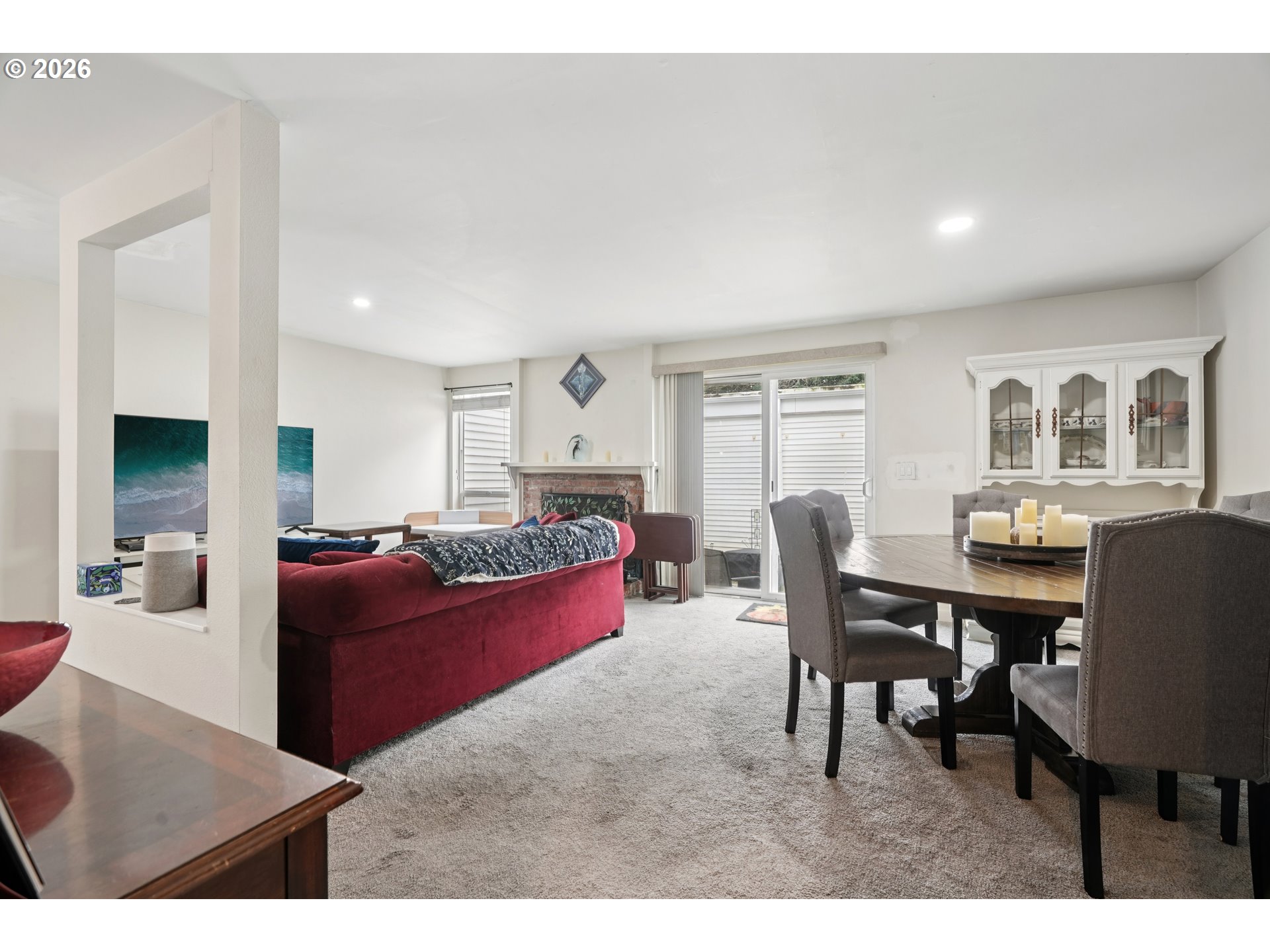 13050 Southwest 17th Street Beaverton, OR 97008 - Photo 7 of 35 a living room with furniture a dining table and a piano table