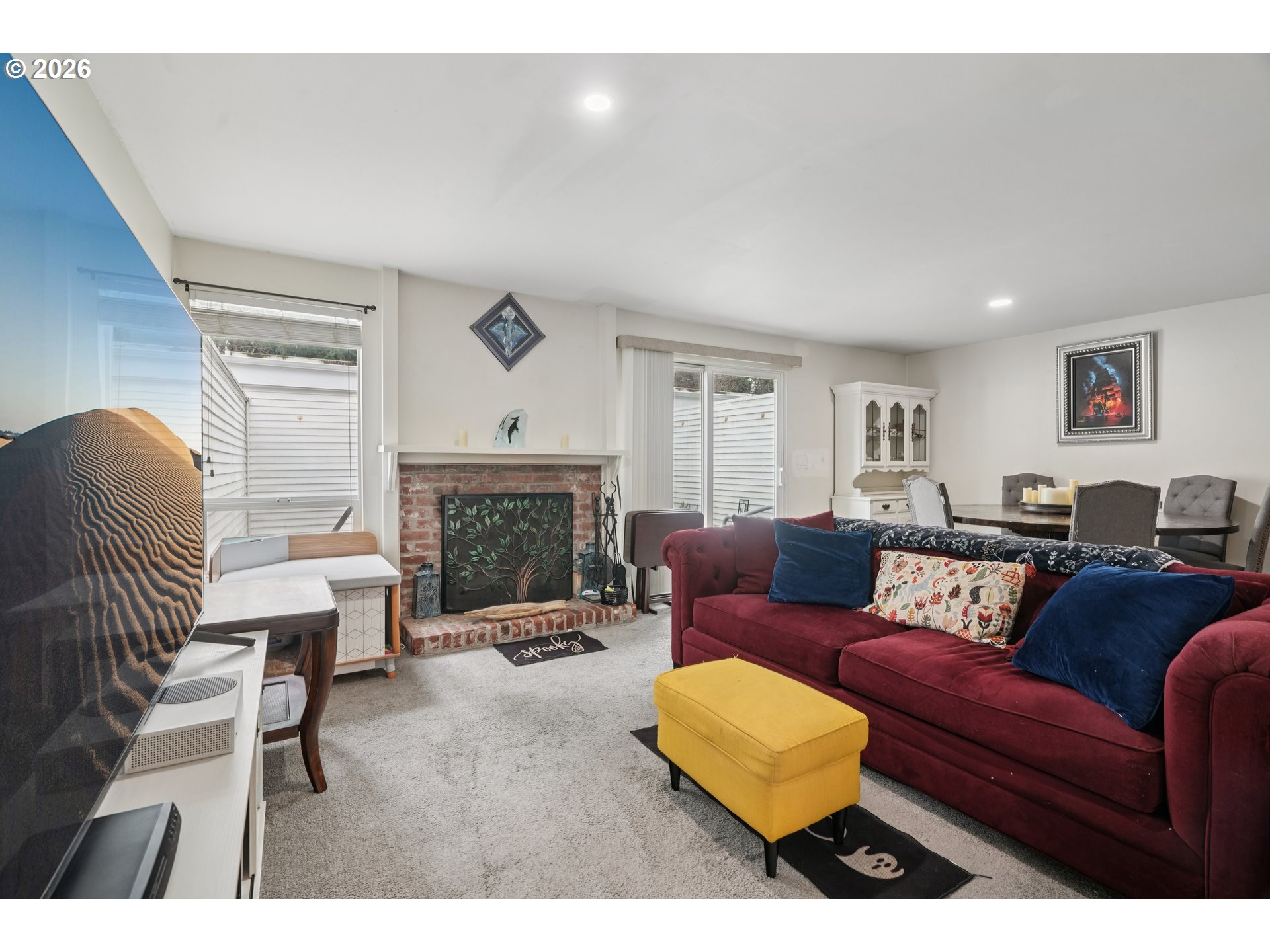 13050 Southwest 17th Street Beaverton, OR 97008 - Photo 10 of 35 a living room with furniture and a fireplace