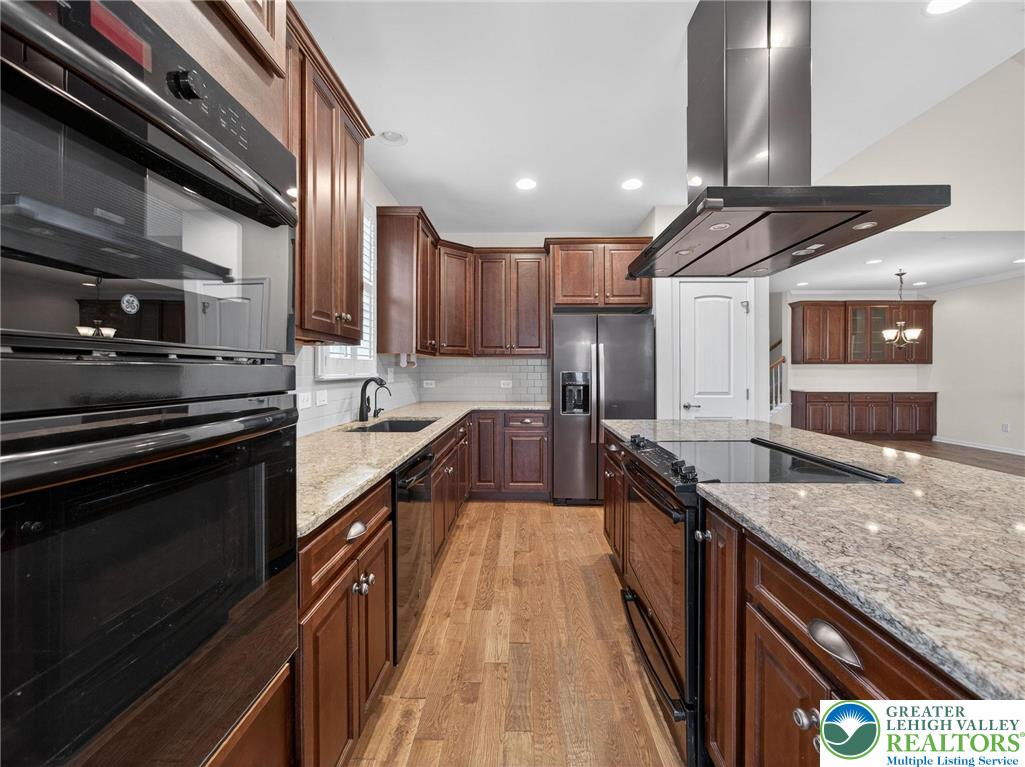 4109 Eveningstar Road Emmaus, PA 18049 - Photo 8 of 53 Microwave/oven combination/pantry/subway tile backsplash